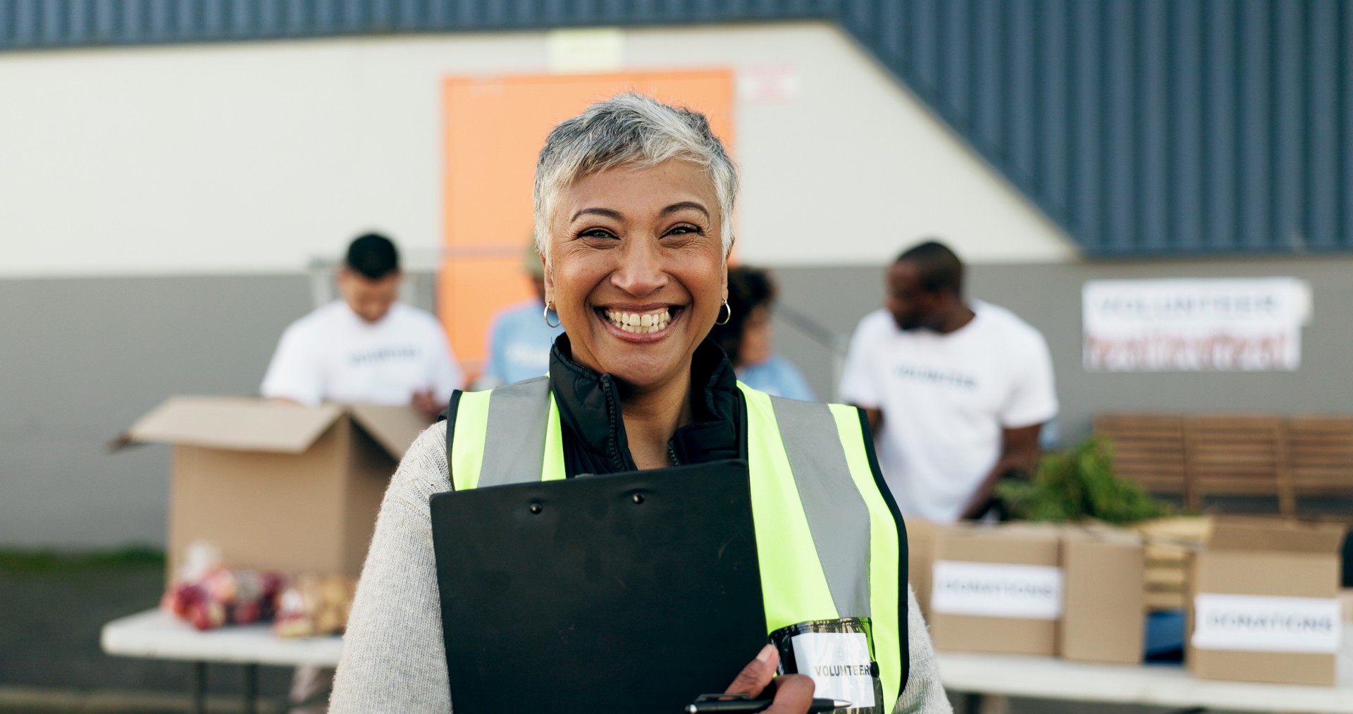 chiWoman, clipboard and manager in charity, volunteer and organizer for outreach program, smile and portrait. Happy senior person, non profit and support in social responsibility for NGO foundation